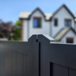 Modern dark gray aluminum driveway gate
