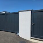 Modern dark gray aluminum driveway gate